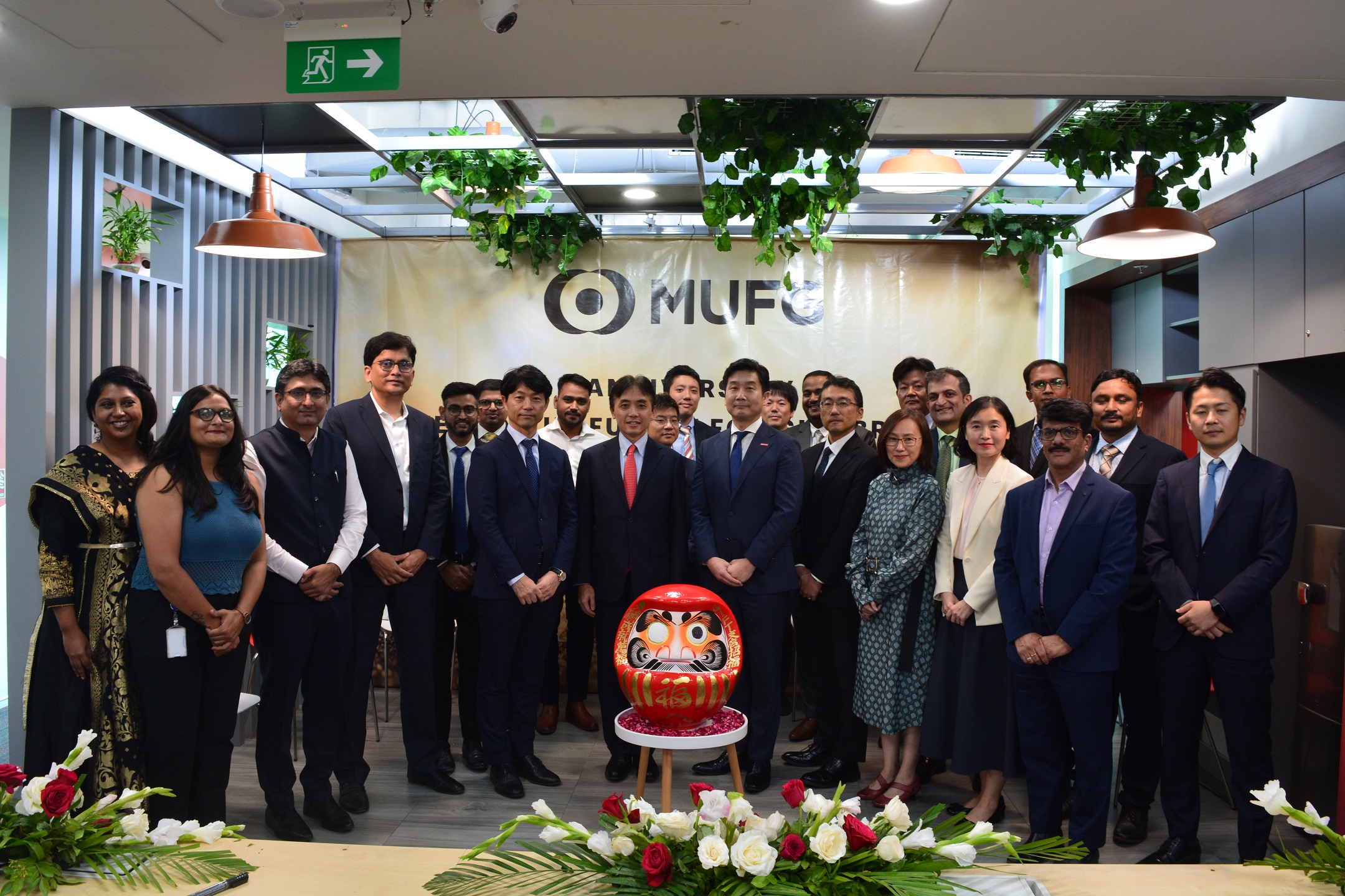 Management and staff celebrating GIFT City branch’s first anniversary
